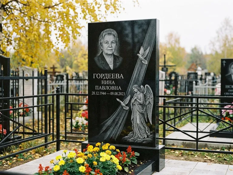 Памятник с гравировкой ангела — гравировка ангела с голубем по диагонали стелы, работа «Гордеева» в Оренбурге